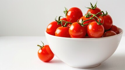 Fresh red cherry tomatoes on white bowl on white background