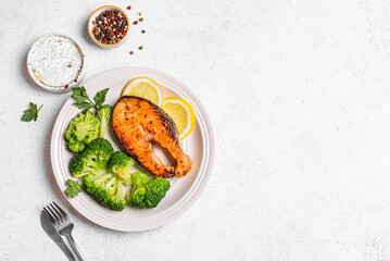 Grilled Salmon fish steak with broccoli. Fitness menu.