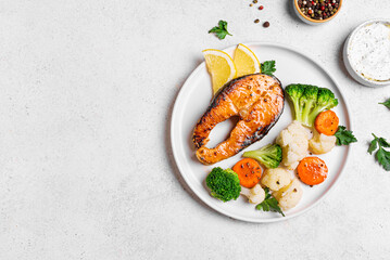 Grilled salmon fish steak with steamed vegetables