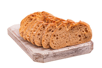 Buckwheat bread sliced on a wooden board isolated on white.