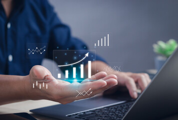 Business data analysis concept with statistical graphs, workflow on dashboard, business performance evaluation and measurement. Man's hand at data analysis graph working on computer on virtual screen