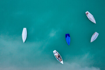 Drone image with fishing boats on Sylvenstein Lake, in Upper Bavaria, Germany
