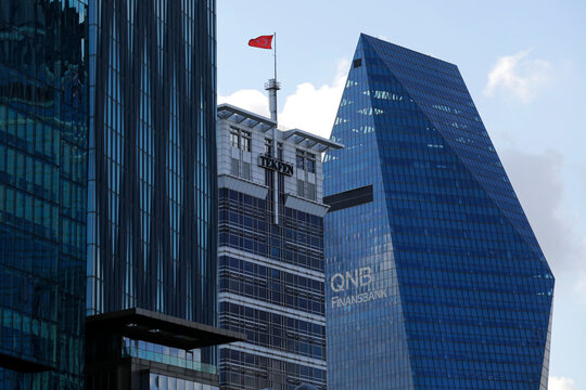 Istanbul, Turkey - August 11, 2020: Tekfen and QNB Finansbank bank buildings are seen in the Levent area, the financial district of the big city of Istanbul.