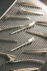 Hair clips on the table. Hairdresser and beauty salon. Professional hair extension. 