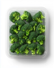 Fresh Broccoli Florets Arranged in a Clear Plastic Container, Displayed on White Background