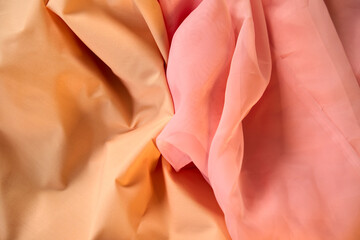 Fabric peach waves - material for background and texture. Close up fabric.