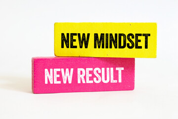 New mindset new result message written on wooden blocks on white background. Conceptual new mindset new result symbol. Copy space.