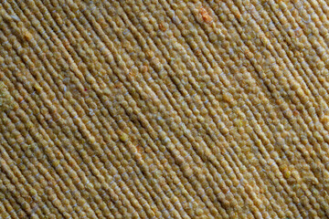 Yellow texture of natural eco fabric, closeup . Background of yellow rough fabric