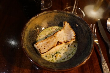 Close up of fancy decorated plates with delicious looking food at a fine dining restaurant in Sweden