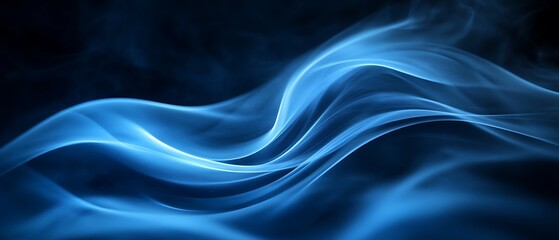 Beautiful flowing blue smoke against a dark background looks artistic