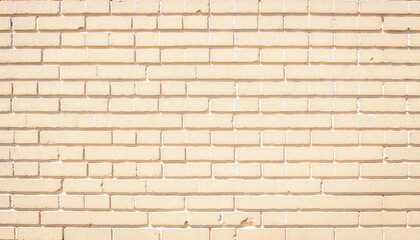 Obraz premium Textured beige brick wall background for design projects 