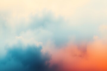 Fototapeta premium Soft pastel clouds blending in shades of blue, orange, and cream, creating a serene sky backdrop