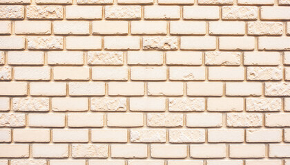 Fototapeta premium Textured beige brick wall background for design projects 