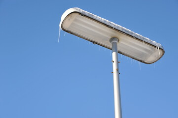 Snowy Street Lamp Under Clear Blue Sky