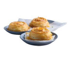 Captivating Still Life of Bulgarian Banitsa, A Delicious Pastry Composition with Crispy Layers and Golden Texture Presented on Elegant Plates for Culinary Appreciation