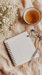 Cozy,  warm,  peaceful  morning  arrangement  with  tea,  journal,  and  glasses