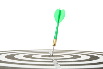 Dart board with green arrow on white background