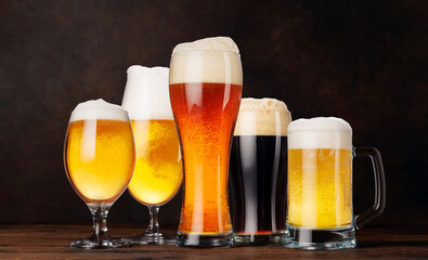 A selection of various beer glasses filled with different types of beer
