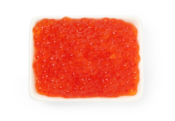 Delicious red caviar in bowl isolated on white, top view