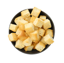 Delicious crispy croutons in bowl isolated on white, top view