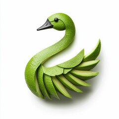 Fototapeta premium A beautiful swan sculpture crafted from fresh avocado slices sits gracefully on white.