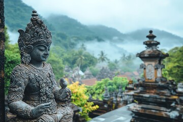 Obraz premium Stone Buddha Statue Overlooking Misty Mountain Landscape in Bali