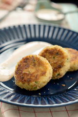 Delicious potato and bacon patties, served on the table.