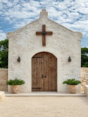 Whitewashed Stone Chapel with Wooden Cross and Door