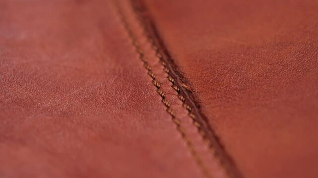 Macro brown leather background, grainy texture. High quality 4k footage