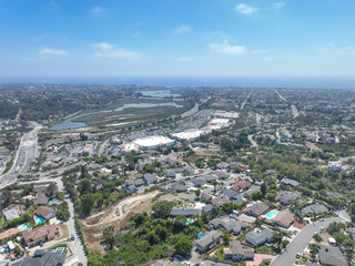 Aerial view of middle class houses in the valley of Oceanside town in San Diego, California. USA.