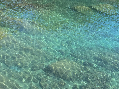 Sea crystal-clear water with underwater stones.