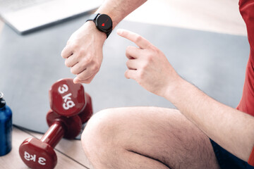 Close up of athlete using smart watch cardio app