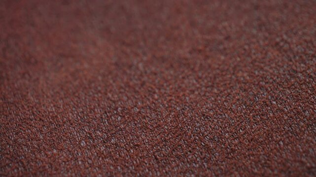 Macro footage of brown leather grain. Concept of texture and background. High quality 4k footage