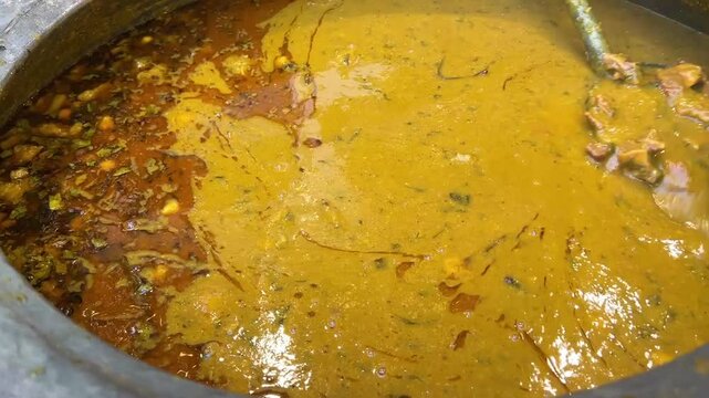 Mutton Haleem cooked in a large containers during Ramadan in India