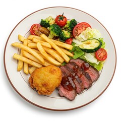 Fried chicken wings with french fries and vegetables on a plate