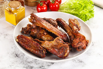 Roasted duck wings with sauce