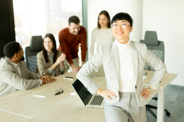 Business professionals collaborate in a modern office setting during a productive meeting session