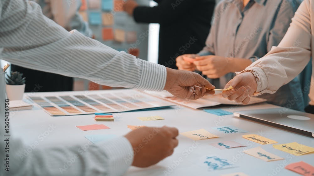 Poster collaborative brainstorming session with sticky notes and color palettes showcasing team interaction