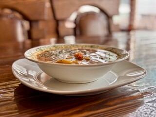 Indulge in a Delicious Bowl of Hearty Soup Made with Fresh, HighQuality Ingredients. A warm and flavorful bowl of delicious soup, packed with vibrant, fresh vegetables and rich, nutritious broth
