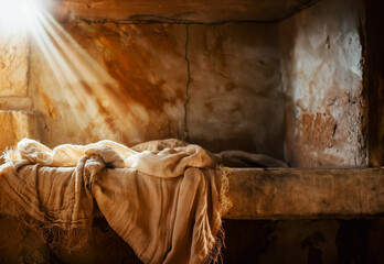 The empty tomb of the risen Jesus with burial shroud