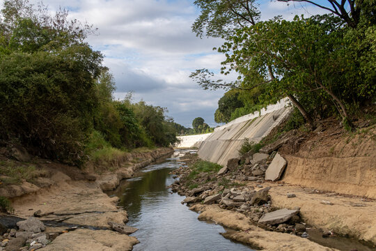 The Ylang Ylang River in Cavite, Philippines, is at a low water level. The river banks are built so it can swallow enormous amounts of water to prevent flooding in the area