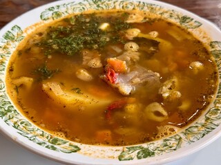 Indulge in a Delicious Bowl of Hearty Soup Made with Fresh, HighQuality Ingredients. A warm and flavorful bowl of delicious soup, packed with vibrant, fresh vegetables and rich, nutritious broth
