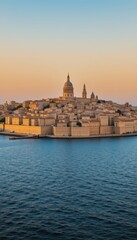 Fototapeta premium Scenic View of Grand Architecture Against Calm Waters at Sunset