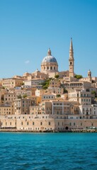 Naklejka premium Coastal Cityscape with Historic Architecture and Blue Sky Background