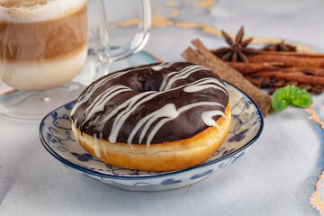 Delicous sweet donut with chocolate glaze