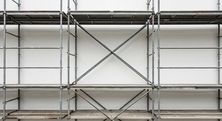 Gray metal scaffolding at construction site against the building wall, for building facade repair, renovation backdrop for graphic designer, architecture background