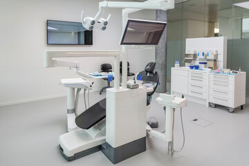 Modern dental clinic with advanced equipment professional dentist chair bright sterile environment high-tech tools for oral care hygiene treatment contemporary medical office for patient examination