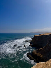 Beautiful ocean view from cliff with rocks and waves 