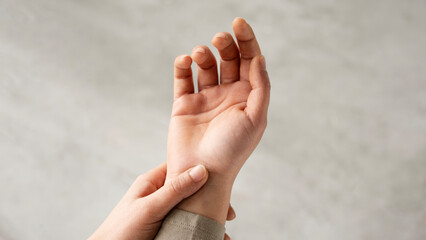 Young woman with wrist pain