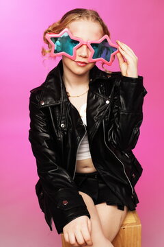 Ten-Year-Old Seated With Star Shades